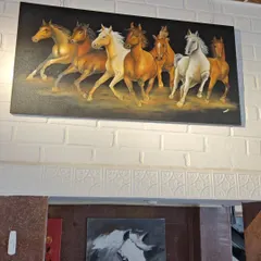 A powerful painting of seven running horses, a significant symbol in Vaastu for bringing success and forward momentum. This piece is displayed in our gallery, showcasing the dynamic energy our artists can capture.