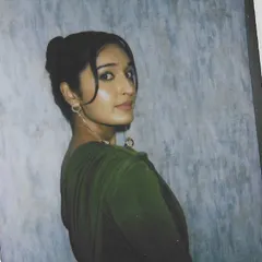 A sleek and sophisticated knot bun hairstyle for influencer Niharika NM. This polished updo is perfect for editorial shoots or red carpet events, offering a clean and elegant look.
