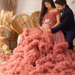 A tender moment between the couple in the boho corner. The way he looks at her and the baby bump is filled with so much love and admiration.