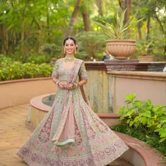 A full-length view of this modern phera look. The soft, flowing lehenga is perfectly complemented by a makeup look that is radiant and fresh, ensuring the bride is comfortable and glowing.