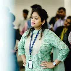 A participant stands in a foundational pose during a corporate workshop. My sessions always include simple, grounding postures that help improve body awareness and posture, which is especially beneficial for those who spend long hours at a desk.