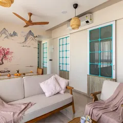 This wide shot captures the serene atmosphere of the living area, where the custom mural provides a stunning focal point that complements the minimalist wooden furniture.