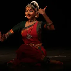 This pose, depicting the goddess holding a veena and a book, is from a solo piece on Saraswati. It's a portrayal of the divine feminine as the source of knowledge and arts.