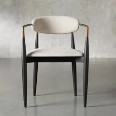 Handcrafted by artisans, our Jagger dining chair delivers a sleek modern design with unfailing comfort. The hand-stained solid mahogany frame is complemented by warm metal accents and a comfortable upholstered seat and back.