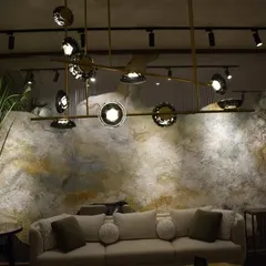 Another shot of the India Art Fair VIP lounge, showing the Ross Gardam Ceto chandelier against a textured wall. My goal was to create a space where lighting and art are in constant dialogue.