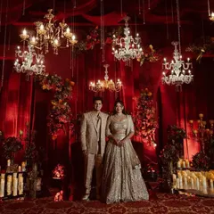 I can transform any space into a royal court with opulent red and gold drapes and dozens of cascading crystal chandeliers for a truly majestic reception.