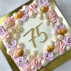A beautiful square cake for a 75th birthday. This 2kg Pineapple cake is decorated with a border of delicate pastel-coloured whipped cream rosettes.