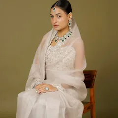 A full view of our emerald and diamond-look set, worn with a delicate dupatta. This look is perfect for a bride who wants to carry her heritage with modern pride.