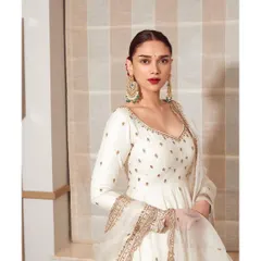 A closer look at the beautiful white Jigar Mali anarkali. The intricate embroidery on the sleeves and the classic silhouette make it a timeless piece.