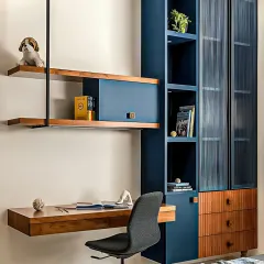 For modern professionals in Bangalore, a dedicated workspace is essential. We designed this sleek, wall-mounted study unit with a floating desk and integrated shelving to create a functional home office without taking up valuable floor space.
