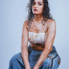 For this conceptual portrait, the goal was to create a raw and intense look. The styling with wet hair and smudged textures, combined with clean studio lighting, creates a striking image perfect for a model's portfolio or an edgy editorial.