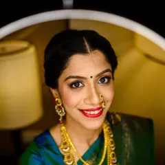 A stunning close up portrait of the bride, Shruti. We used the warm light from the hotel room lamps to create this beautiful, glowing effect that highlights her features and radiant smile.