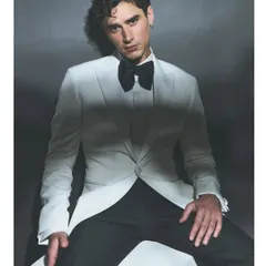 For the discerning groom, a classic white tuxedo offers unparalleled sophistication. I styled this look to emphasize sharp tailoring and a clean silhouette, perfect for a formal reception or cocktail evening. The oversized black bow tie adds a touch of modern drama to this sartorial masterpiece.