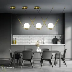 This modern pendant light with three globe lights is a great choice for a kitchen or dining area. The wavy gold bar adds a sculptural element, and the frosted globes provide soft, glare-free light.