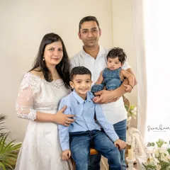 A classic and beautiful portrait of a family of four. I work to make everyone feel comfortable, resulting in natural smiles and a photo you'll treasure.