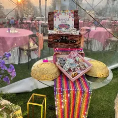 We create engaging experiences like this 'Bangle Bar' for a Mehendi ceremony. This interactive wedding favor station allows guests to choose their own colorful bangles, creating a memorable and personalized takeaway from your event.