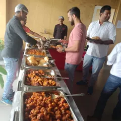 Guests enjoying a wide variety of dishes from our buffet. We ensure the line moves smoothly and the food is always plentiful and appealing.