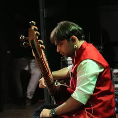 A side view from the stage, preparing to play. Whether on a big stage or in a small classroom, my goal is always to connect with the audience through the honest expression of music.