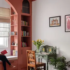 I believe every home needs a quiet corner for reflection. We created this cozy window seat and reading nook with custom-built shelving, turning an unused space into a personal haven for getting lost in a book.