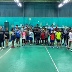 A full group of our junior badminton players and coaches on match day. The energy and enthusiasm are what make these events so special.