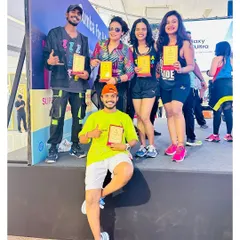 Receiving an award with my fellow instructors at the "Zumba for a Cause" event. I'm so grateful to be part of this initiative.