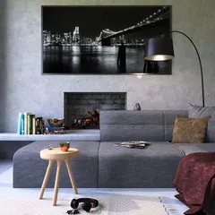 This modern living room features a light grey concrete-style paint finish. This gives the space an industrial yet sophisticated look, proving that neutral colors can be impactful.