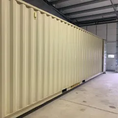 The exterior of a standard high-cube container, showcasing its robust and uniform structure. This is the foundation of every project we build, prized for its strength and modularity.