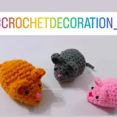 A trio of colorful crochet mice. These small amigurumi toys are great as party favors, small gifts for kids, or even as cute playthings for pets.