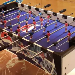 A clear shot of our professional-grade foosball table available for rent. It's a durable and high-quality table that can handle hours of gameplay at any event.