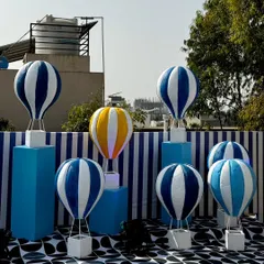 From concept to execution in just 42 hours. This St. Tropez inspired decor in Ahmedabad involved transforming a bungalow with custom-painted walls, fruit-based installations, and unique props, all on a tight deadline.