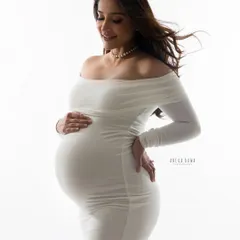 A high-key portrait where the mother-to-be is bathed in light. This technique creates a radiant, angelic glow, emphasizing the beauty and serenity of pregnancy.