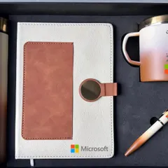 This two-tone cream and brown set for Microsoft shows another color variation. It includes a diary with a card holder, a matching pen, and a dual-color insulated mug, all neatly fitted into a custom box.
