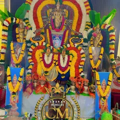 A grand deity decoration for a temple event. I used colorful flower garlands to create an elaborate arch around the idols of the gods and goddesses.