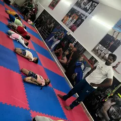 Students rest after a tough conditioning drill. Even during rest, the discipline and focus remain.