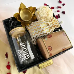 A corporate Diwali gift set curated for the BMW Group. It features a branded glass tumbler, premium cookies, and a traditional diya, presented in a sleek black box.