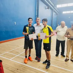Zehn and his doubles partner receiving their awards at the FOZAWAC tournament. Teamwork and synergy are key components of our doubles training program.