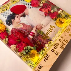 A close-up of the bestselling block art, highlighting the vibrant flowers and the couple's romantic photo.