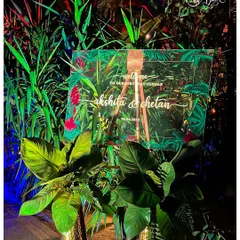 A personalized welcome sign is the first touchpoint for guests. For this jungle party, I designed a custom acrylic sign with a lush tropical print, setting the tone for the event from the moment of arrival.