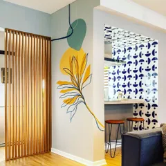 This subtle wall art combines organic shapes and a curated color palette to create a sophisticated accent. We can work with you to design and paint a feature that complements your home's aesthetic.