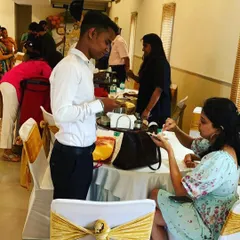 Our staff ensuring guests are well taken care of, serving them directly at their tables for a more personal touch.