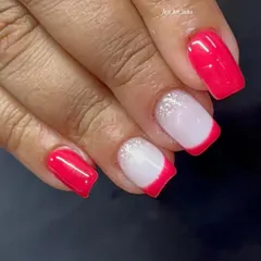 A fun take on the French manicure with a bright pink tip and a soft glitter ombré.