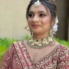 A close-up of the bridal makeup, detailing the soft eyeshadow blend, neat eyeliner, and the perfect shade of lipstick to complete the look.