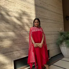 I designed this vibrant red cape set for a festive occasion. The dhoti-style pants and attached cape create a dramatic silhouette that’s both modern and rooted in Indian design.