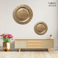 I love adding a touch of metallic warmth to a space. These embossed metal wall platters, shown here in an antique gold finish, are perfect for creating an accent wall. Their detailed patterns catch the light and add a layer of quiet luxury above a console or sideboard.