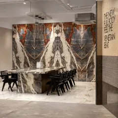 Luxury redefined at an Italian tile showroom in Mumbai. Here, extra-large tiles mimicking luxurious marble adorn the walls and a communal table, transforming the ordinary into the extraordinary.