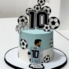 A perfect kick-off to turning 10! This football-themed cake for a young champion features Messi, bold colors, and sporty details to score birthday goals in style.