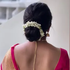 The complete South Indian bridal bun, a perfect circle of fragrant jasmine.