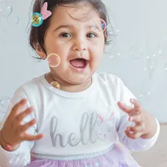 The pure delight of a baby playing with bubbles. This shot captures a moment of innocent wonder and happiness, with the bubbles adding a magical, iridescent touch.