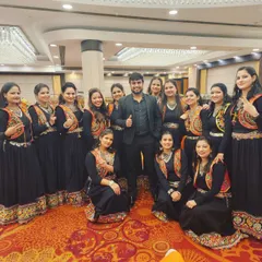 A group photo with the talented ladies' group after their performance at an HMEL company event. I choreograph routines for all employee groups, ensuring everyone can participate and shine.