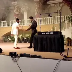 Shaking hands with Manish Paul by my sand art setup. Being part of such a grand event in Mumbai was an honor and a testament to the power of live art.